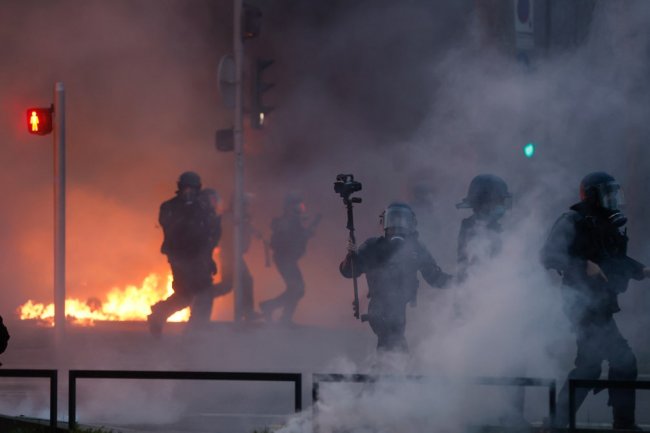 Macron faces 800,000-person protest in Paris over pension reform