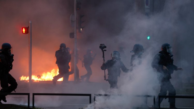 Macron faces 800,000-person protest in Paris over pension reform